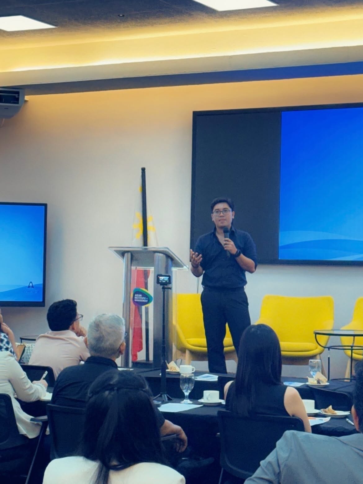 Mo Tolentino speaking at a training
